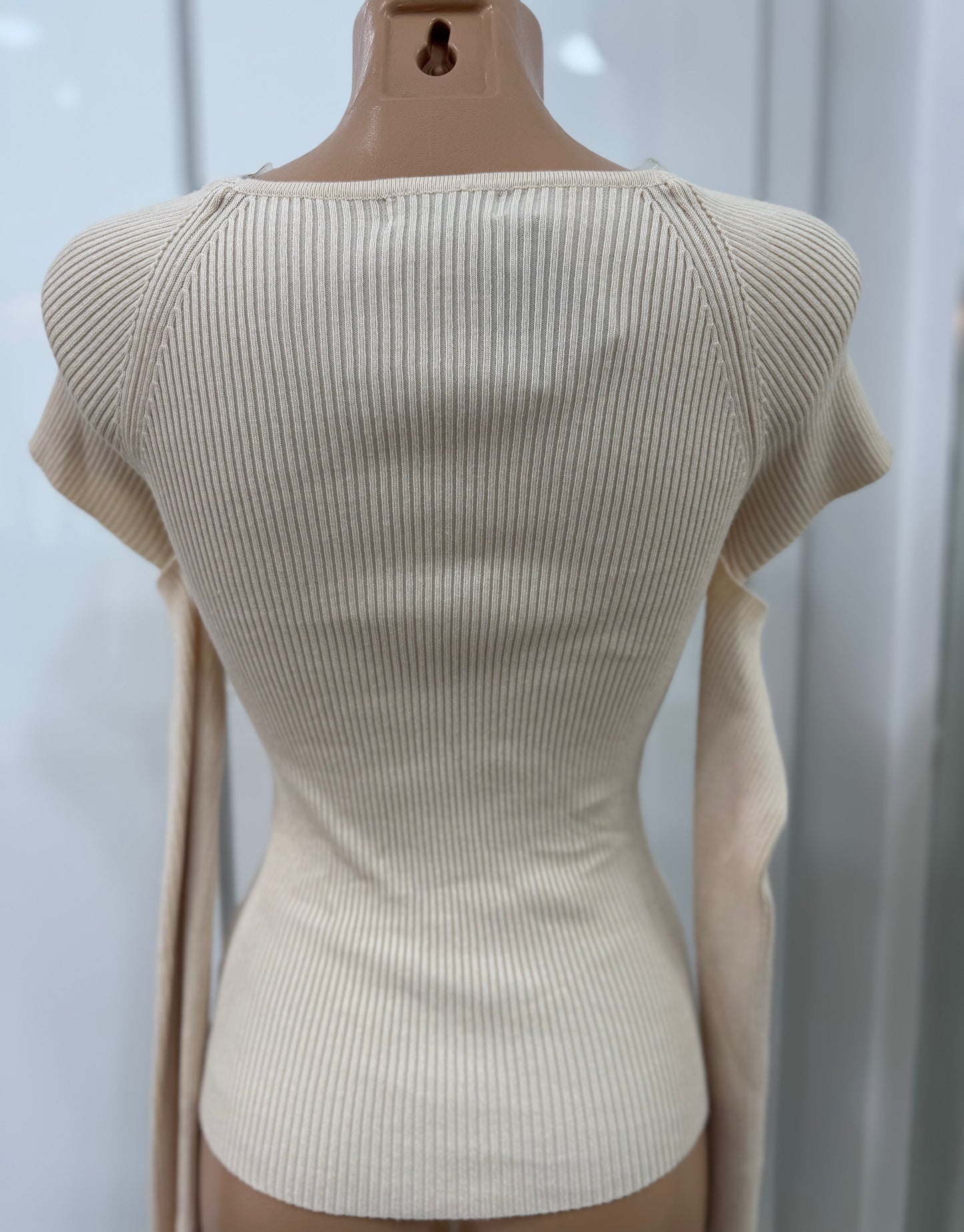 Pull manche coupée