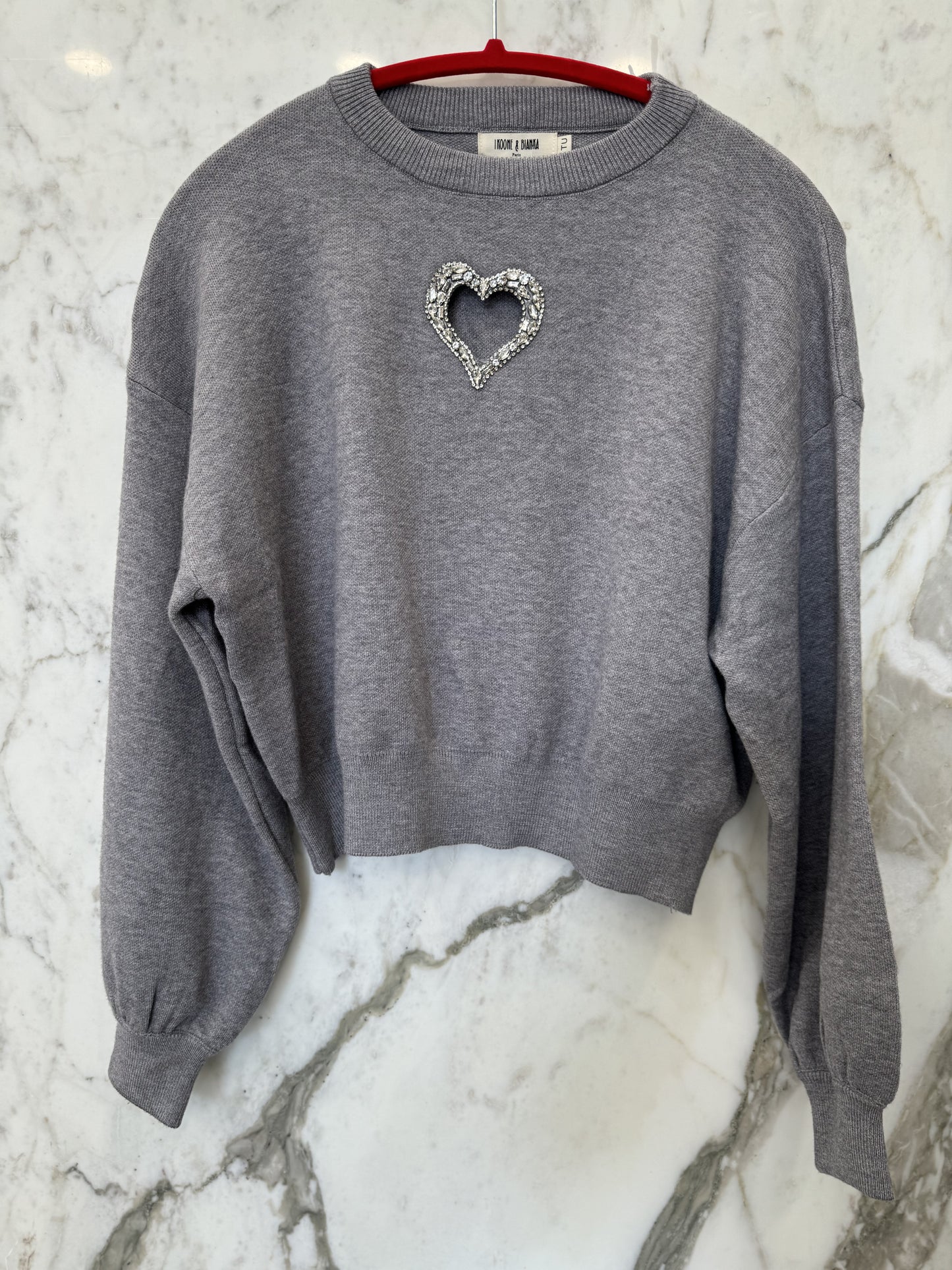 Pull trou coeur strass